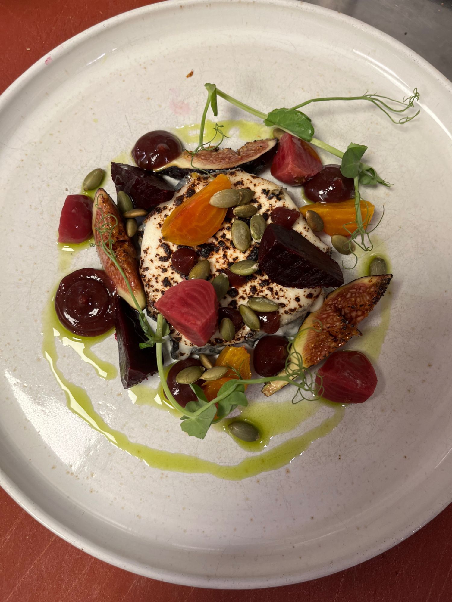 Charred cheese with roast red and golden beetroot, figs, pumpkin seeds and pea shoots
