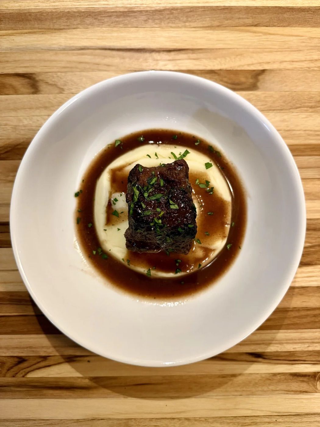Braised short rib on mash with a dark jus